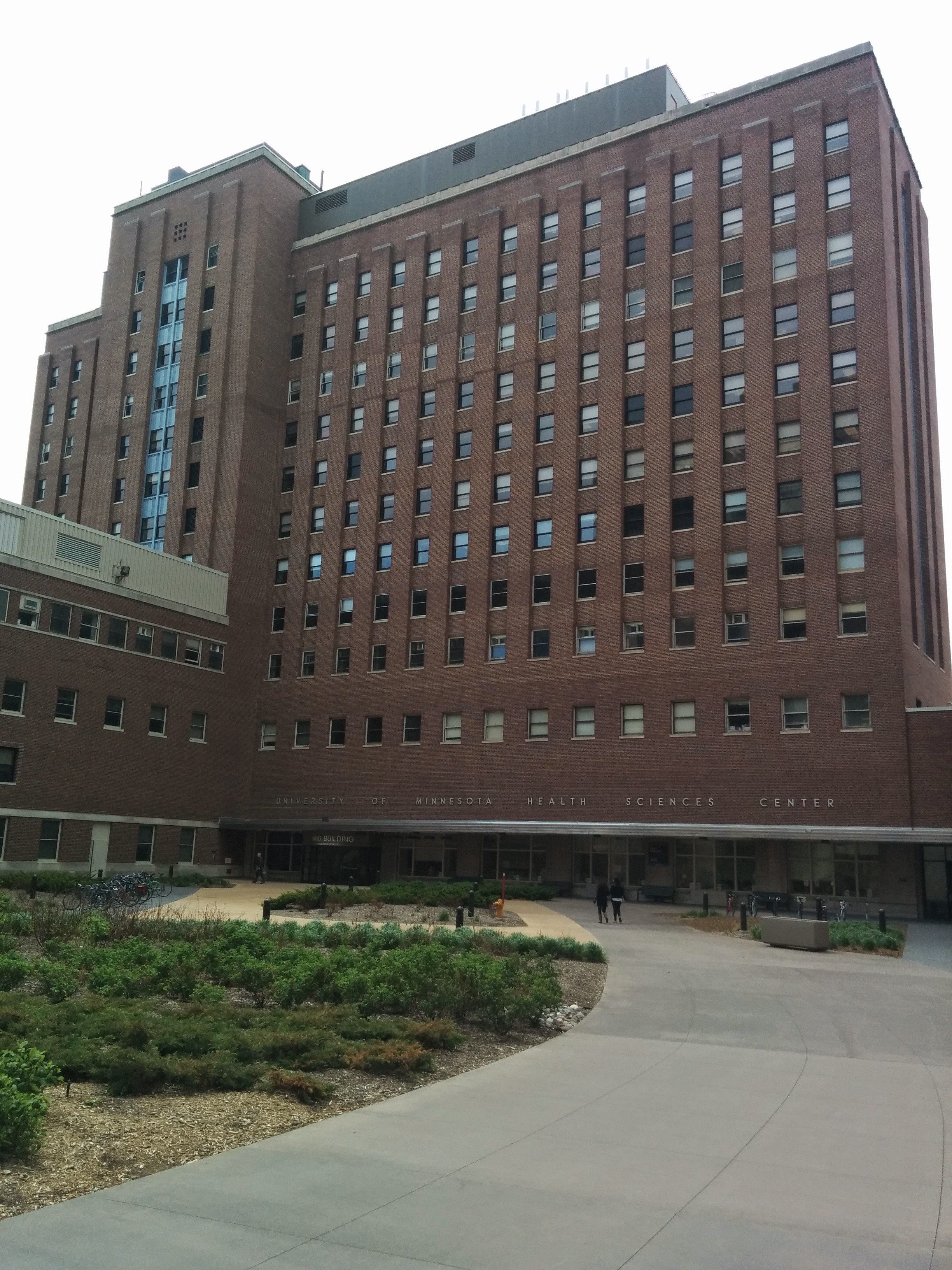 Brick facade of the University of Minnesota’s Mayo Building, with health sciences lettering above the entrance.