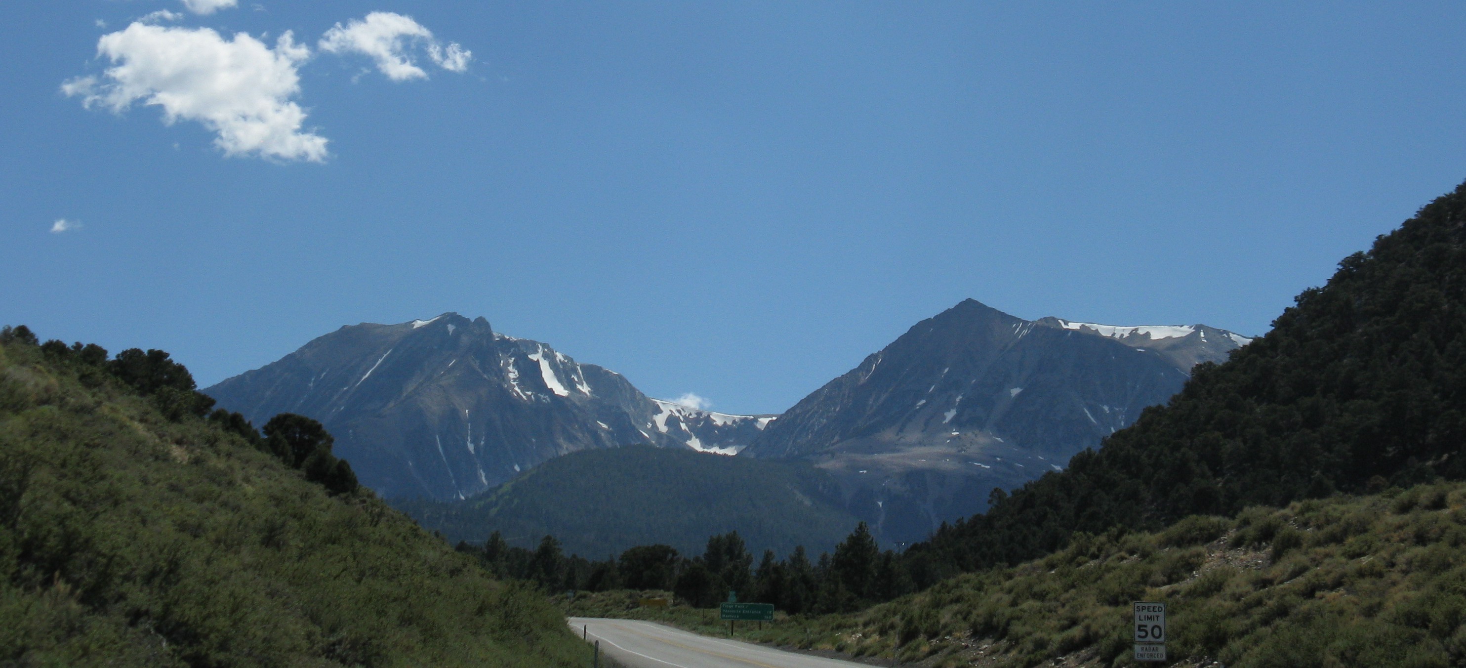 A mountain highway near Lee Vining, with snow patches on distant peaks.