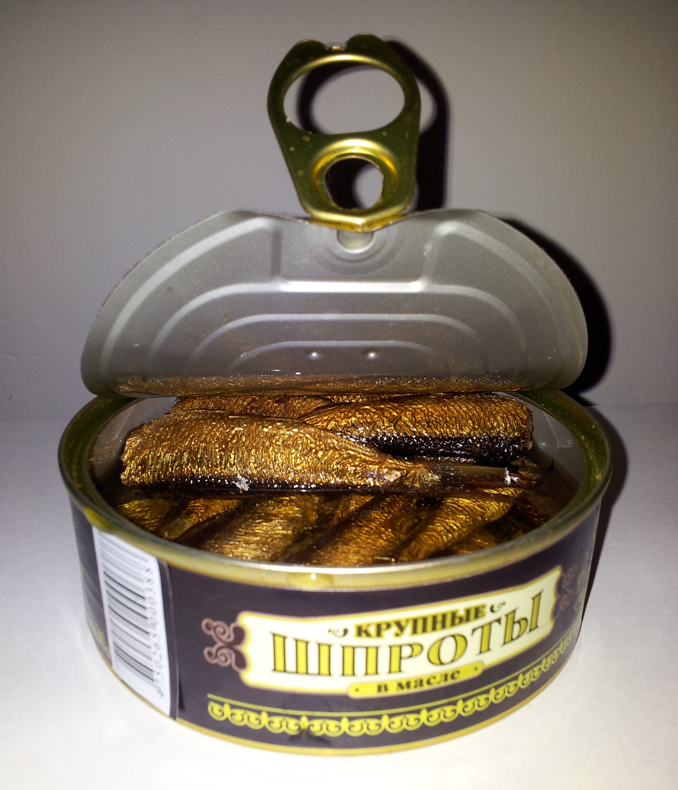 An open tin of smoked sprats of a different product from the recalled fish.