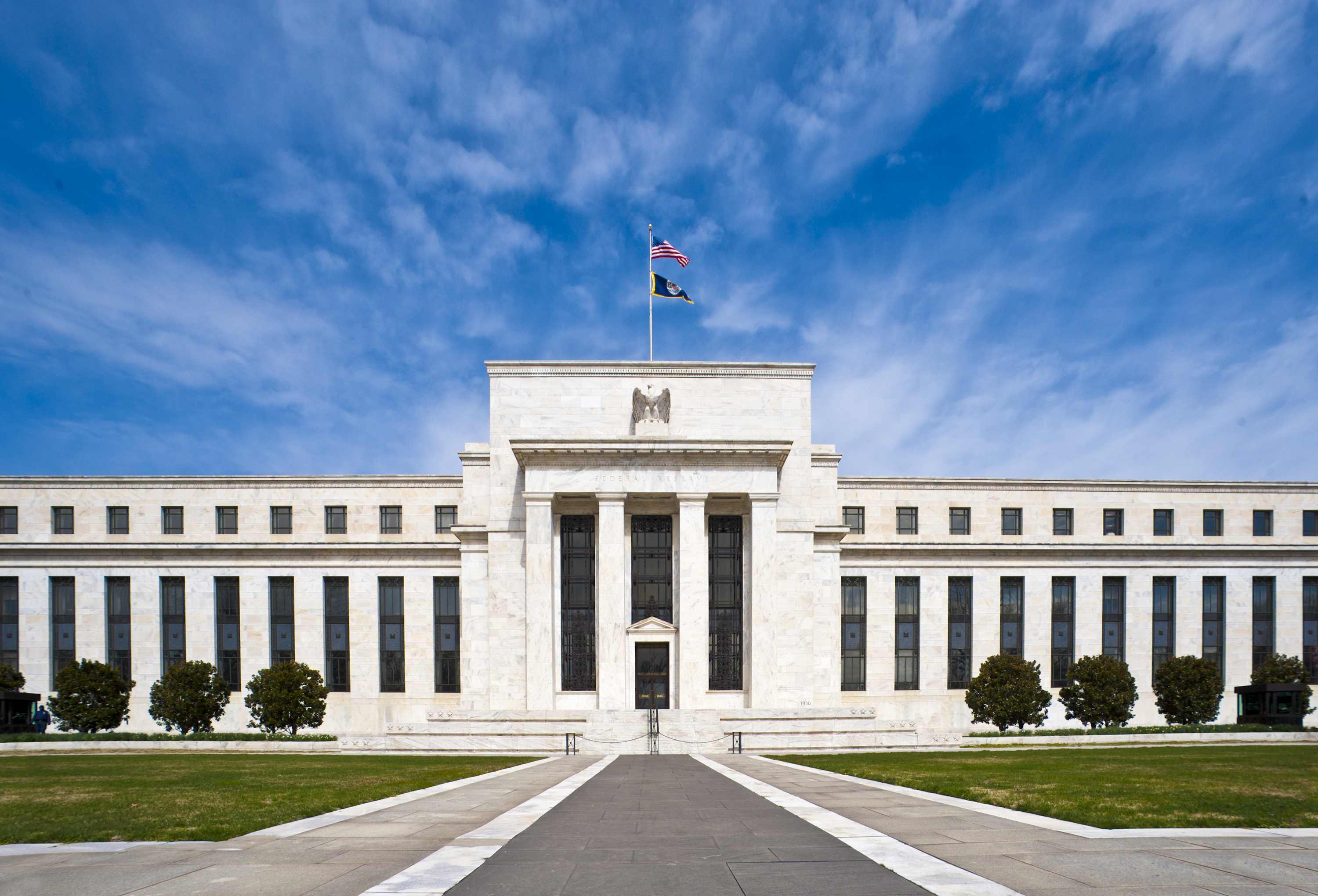 The Eccles Building of the Federal Reserve, seen across its landscaped grounds.