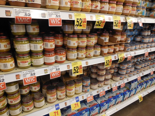 Jars of baby food displayed on store shelves.